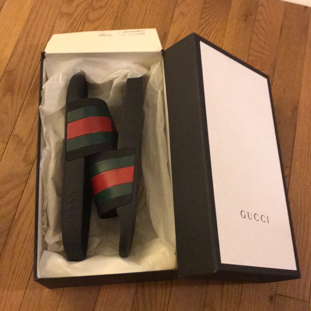 Gucci slides size 13. Still has Box and dust bags.